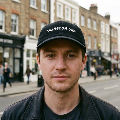 Man wearing the Islington Dad corduroy cap in Black on Upper Street, Islington, North London