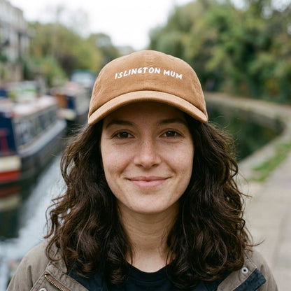 Woman wearing the Islington Mum corduroy cap in Camel by the Regent's Canal, Islington, North London