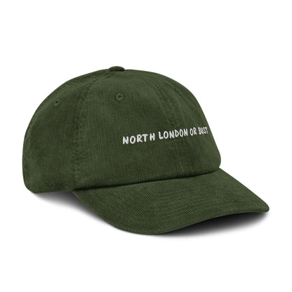 North London or Bust corduroy cap in Dark Olive, angled view, white embroidery, Islington Vibes