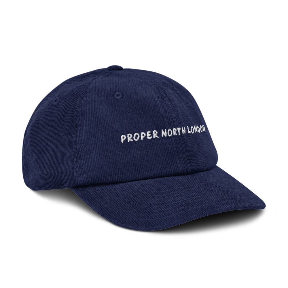 Proper North London corduroy cap in Oxford Navy, angled view, white embroidery, Islington Vibes